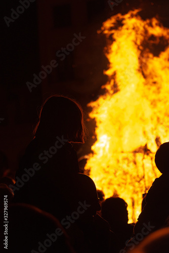 group of people enjoying a bonfire in a festive atmosphere. unrecognizable people. Party and vacation concept. Christianized Celtic party. © Alberto