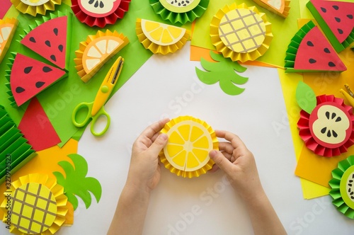Fototapeta Naklejka Na Ścianę i Meble -  Fruit made of craft paper. Children's hands.