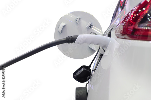 Close-up gripping of electric charge machine connected with plug for charging battery on white smart car (EV Car), isolated on white background, selective focus at gripping plug