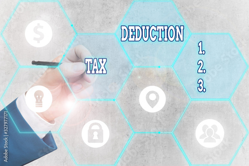 Conceptual hand writing showing Tax Deduction. Concept meaning amount subtracted from income before calculating tax owe