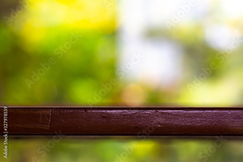 Empty wooden table texture, Green garden blurred bokeh background, Selective focus