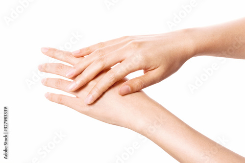 Woman two hands touch each other for cosmetic isolated on white.