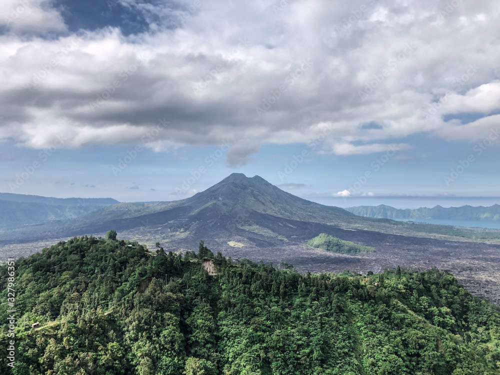 Bali, Indonesia - 27 April 2019 : Landscape nature view of Mt Agung, Mt Batur and Mt Abang and natural lake as tourist attraction point to have a breathtaking view