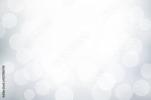 White and grey bokeh effect, Winter snowy background, Abstract blurred vector backdrop.