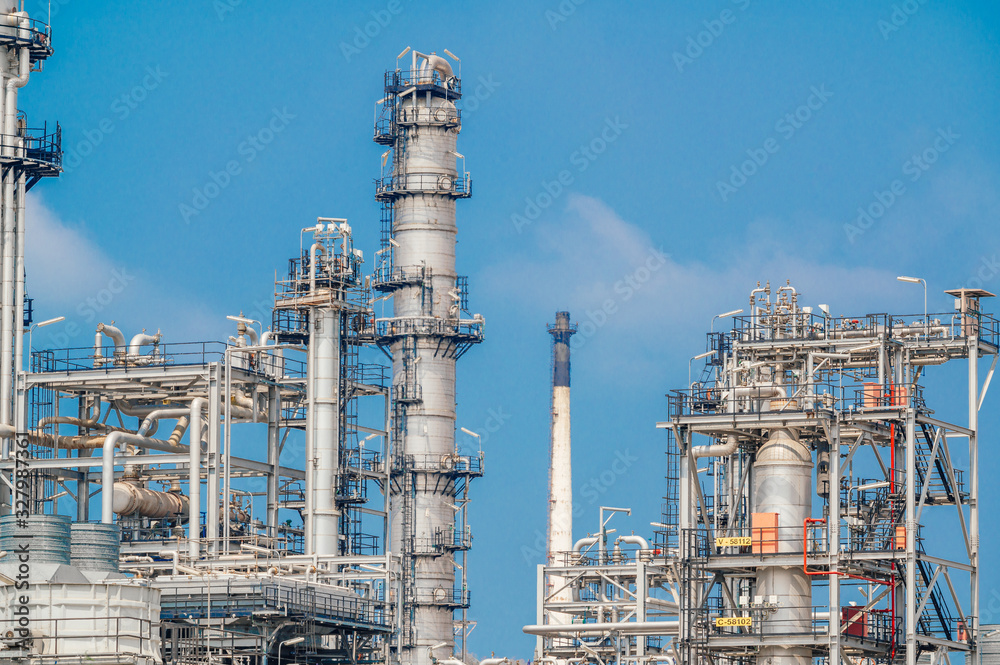 Industrial zone,The equipment of oil refining,Close-up of industrial pipelines of an oil-refinery plant,Detail of oil pipeline with valves in large oil refinery. Industrial zone,The equipment of oil refining,Close-up of industrial pipelines of an oil-refinery plant,Detail of oil pipeline with valves in large oil refinery.
