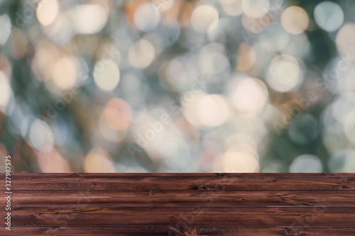 blur bokeh with wooden table top for background, industrial dark color tone.