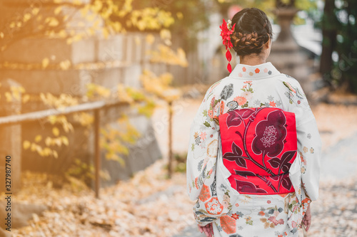 Valokuvatapetti Young women wearing traditional Japanese Kimono with colorful maple trees in autumn is famous in autumn color leaves and cherry blossom in spring, Kyoto, Japan