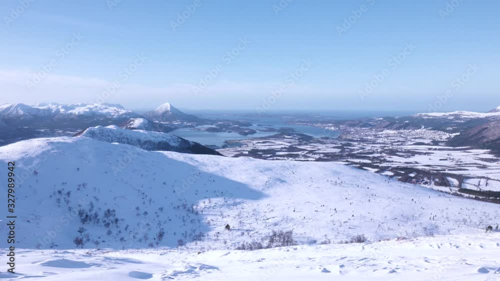 Beautiful snowy mountains and hills as far as the eye can reach with slight camera zoom out. Beautiful snowy mountains and hills as far as the eye can reach with slight camera zoom out.