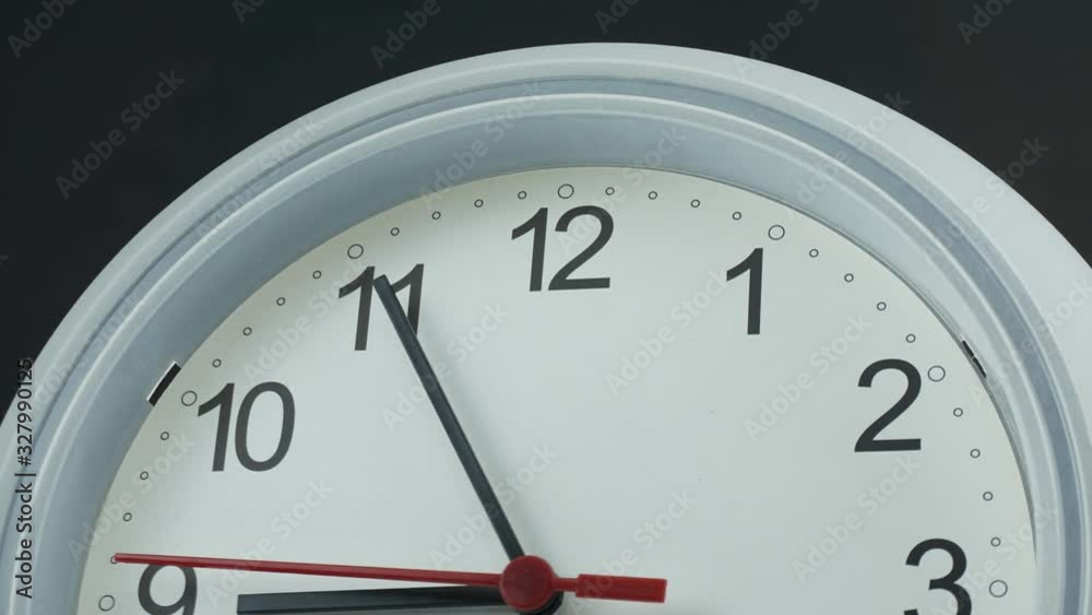 Move the camera angle from left to right, White wall clock face beginning of time 08.45 am or pm. Time lapse 30 minutes moving fast. Move the camera angle from left to right, White wall clock face beginning of time 08.45 am or pm. Time lapse 30 minutes moving fast.