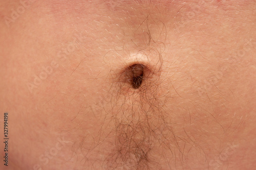 Obraz na plátně male belly button on the stomach with black hair