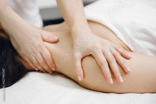 Massage professional of neck for sport woman in salon beauty spa © Parilov