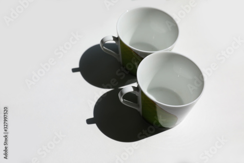 two empty cups on the white table
