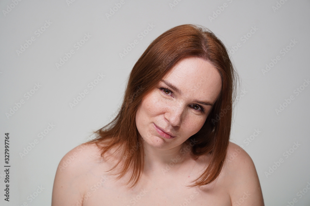 woman with freckles, red hair on white background woman with freckles, red hair on white background