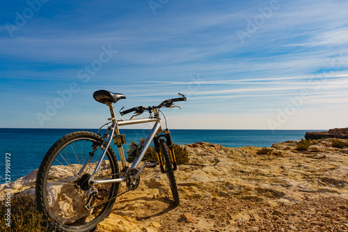 Fototapeta Naklejka Na Ścianę i Meble -  Bicycle on beach, active lifestyle.