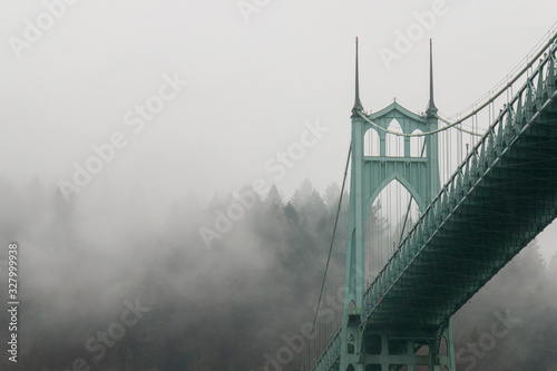 Portland, Oregon's St. Johns Bridge with Foggy Forest Park in the background