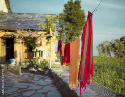 Clothes hanging to dry in a small village (ID: 328001150)