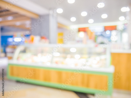 image of blur bakery shop with bokeh for background usage.