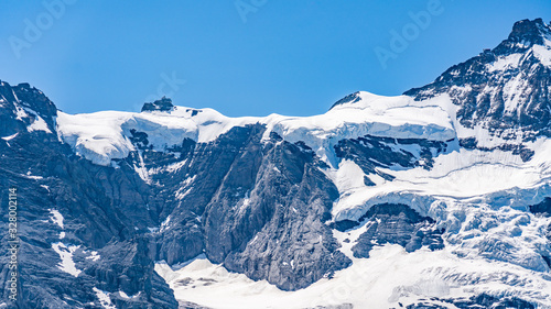 Switzerland, Panoramic view on Eiger, Monch and Jungfraujoch and green Alps around Mannlichen © AlehAlisevich