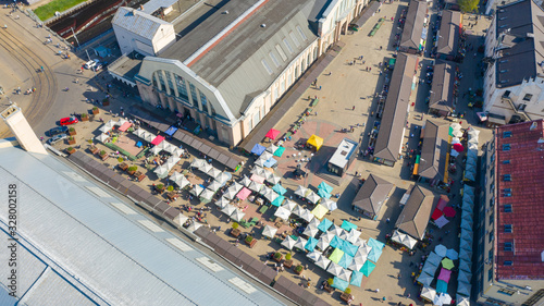Riga, Latvia – July 18 2019: Aerial view photo from flying drone panoramic on Riga Central market located in the city center next to the Daugava river.
