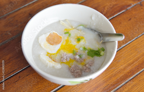 Chinese congee with salted egg and soft-boiled eggs