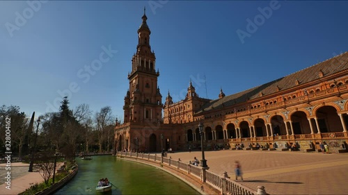 4K Timelapse of the Plaza de Espana (Spain Square) with the canal, wood rowing boats and tourists visiting, in Seville City.