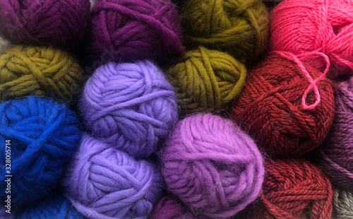 Wool clews colorful hobby background 