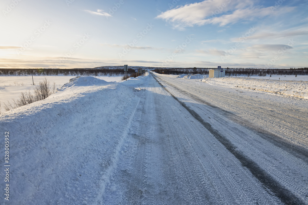 Sunset in the Tundra. The road from Murmansk to Teriberka through the Tundra, Russia