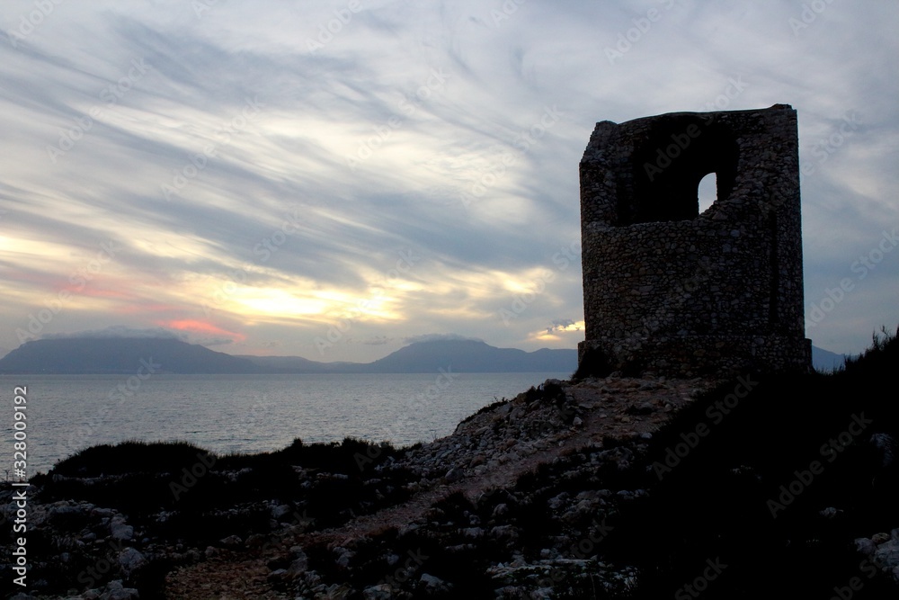 evocative image of pirate watchtower on the sea with sea coast in the background