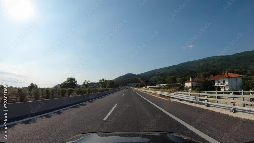 Summer road trip on Europe, first-person view of a moving car on a highway, ride near tunnel under the mountain. Summer road trip on Europe, first-person view of a moving car on a highway, ride near tunnel under the mountain.