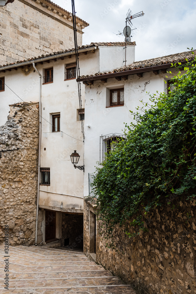 Cobblestoned street and traditional houses in the medieval town of Pastrana, Spain Cobblestoned street and traditional houses in the medieval town of Pastrana, Spain