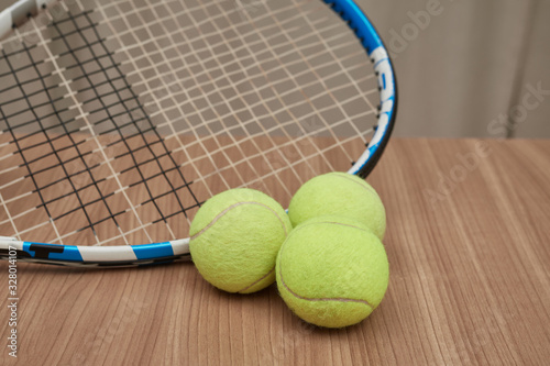 Still life of three tennis balls and a piece of racket of tennis
