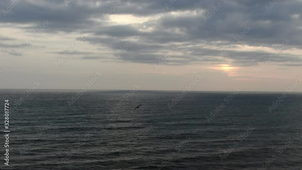 Flying seagulls over the waves of the surf in the sea of Bali, Indonesia. Drone shooting. Flying seagulls over the waves of the surf in the sea of Bali, Indonesia. Drone shooting.