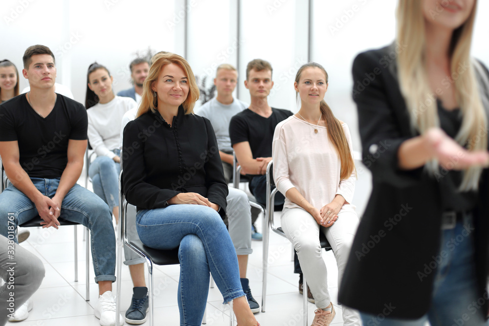 group of diverse young people sitting in a conference room group of diverse young people sitting in a conference room