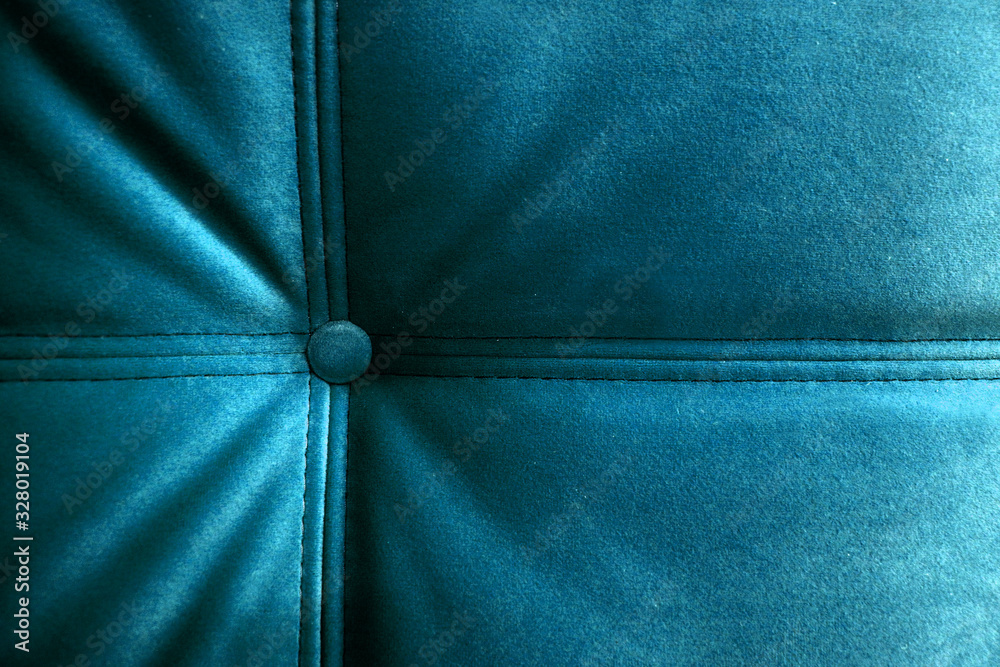 Bright turquoise headboard and bed Board upholstered with button and decorative stitching. Close-up photos. Bright turquoise headboard and bed Board upholstered with button and decorative stitching. Close-up photos.