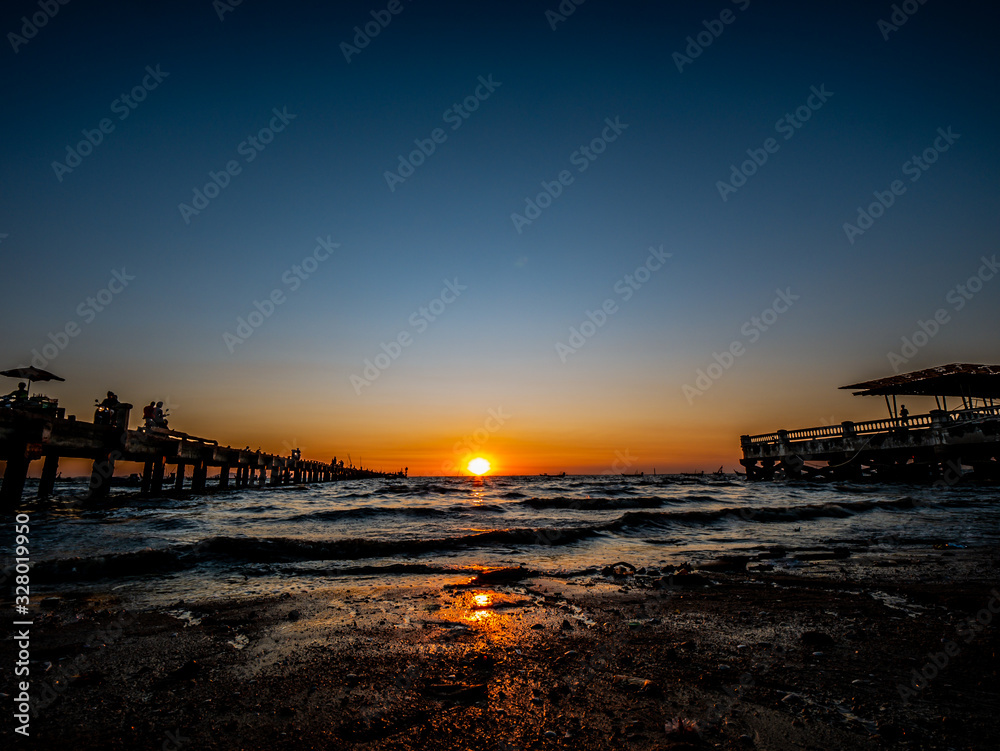 Photos of the sunset on the sea at Wonnapa Beach Thailand.