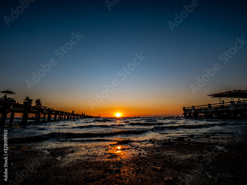 Photos of the sunset on the sea at Wonnapa Beach Thailand.