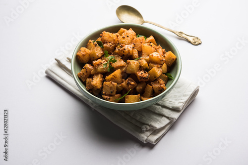 Kaccha Papita Sabji or Raw Papaya Sabzi, served in a karahi or bowl. selective focus photo