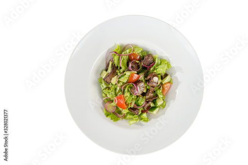 Caesar salad with chicken liver, meat, beef, tomato, onion, cucumber, lettuce on plate, white isolated background, view from above. For the menu, restaurant, bar cafe
