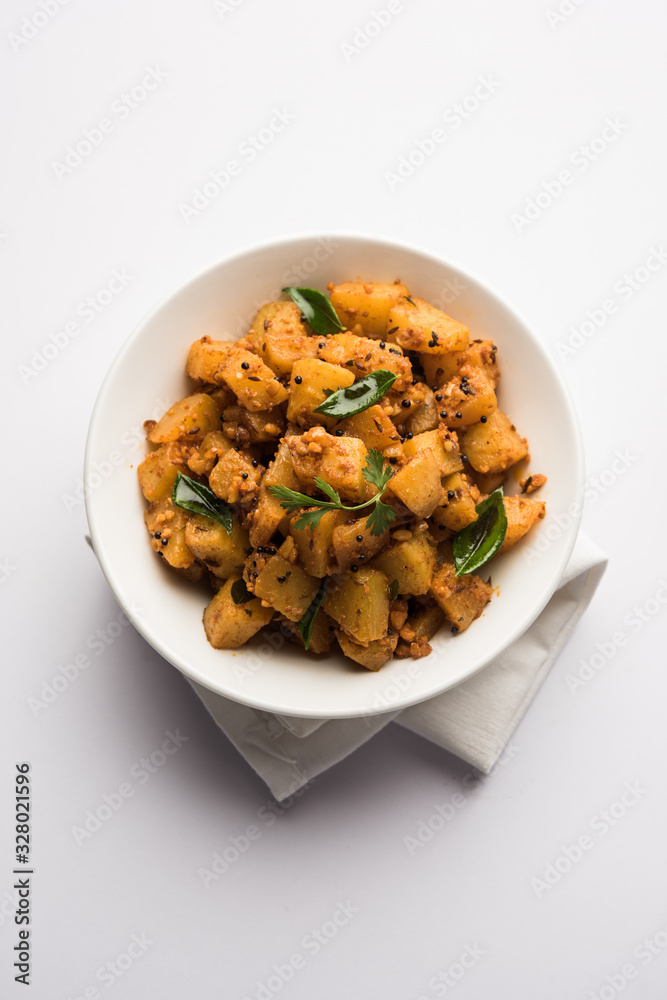 Kaccha Papita Sabji or Raw Papaya Sabzi, served in a karahi or bowl. selective focus Kaccha Papita Sabji or Raw Papaya Sabzi, served in a karahi or bowl. selective focus