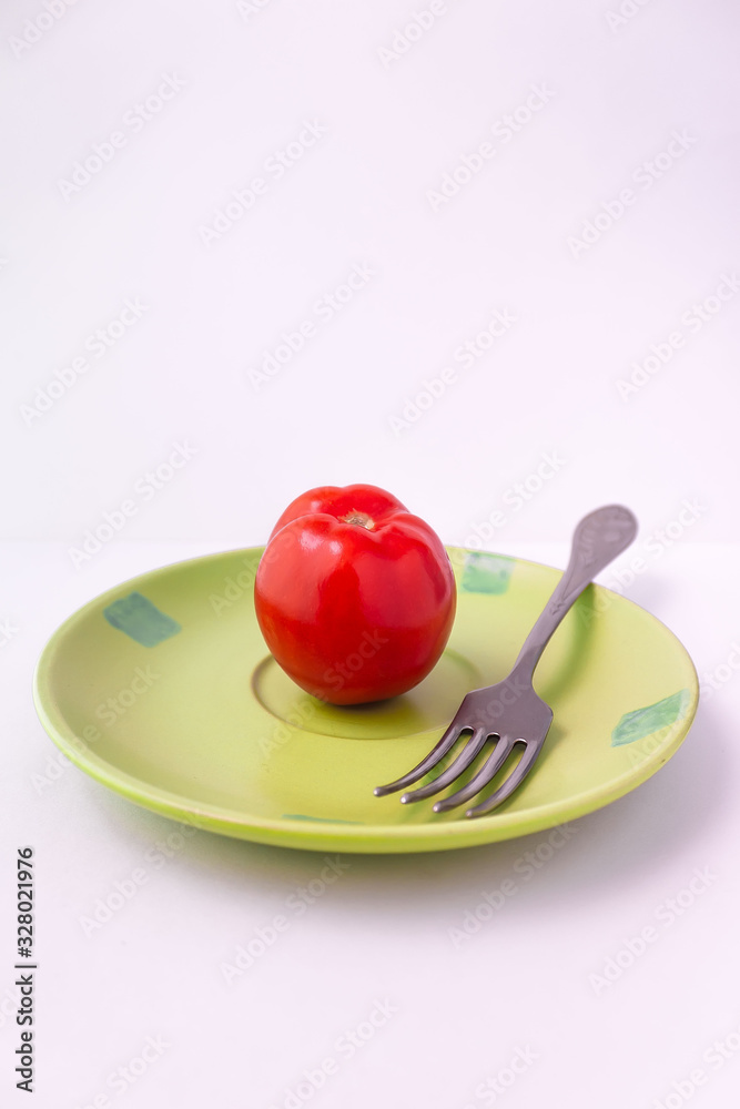 Fototapeta jabłko na talerzu z widelcem i nożem