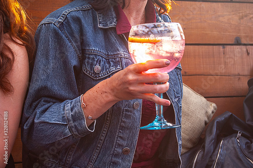 Drinking pink gin in Kensington, London, in summertime