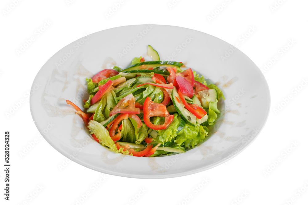 Vegetable salad with lettuce, cucumber, tomato, bell pepper, oil on plate, white isolated background Side view. For the menu, restaurant bar cafe Vegetable salad with lettuce, cucumber, tomato, bell pepper, oil on plate, white isolated background Side view. For the menu, restaurant bar cafe
