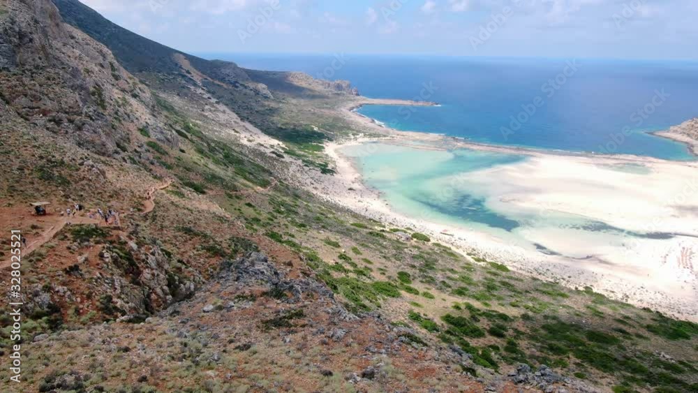 AERIAL: Mountainous landscape and white sand beaches in the background. turquoise ocean. Crete, Greece AERIAL: Mountainous landscape and white sand beaches in the background. turquoise ocean. Crete, Greece