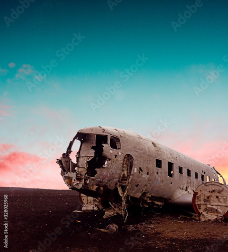 Plane wreckage with sunset in Iceland