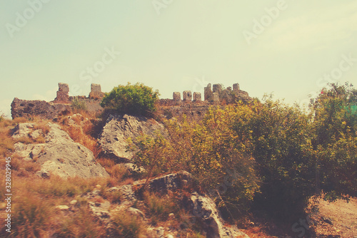 landscape with elements of an old historic fortress in the Turkish city of Alanya on a warm summer day