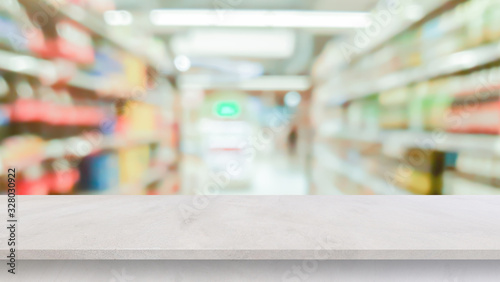 blur local supermarket convenience store background with cement perspective tabletop to showing product or ads banner and promote marketing on display concept 