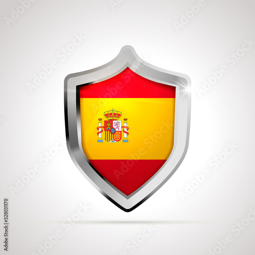 Spain flag projected as a glossy shield on a white background
