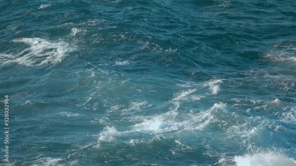 Big Waves rolling crashing coast Blue Turquoise Gale, breaking tide, whitewash.  Sunny day over the sea.  Huge swell hitting shoreline.  Powerful waves Atlantic Ocean shot URSA 4.6K