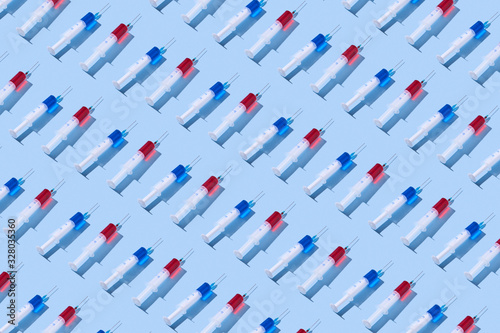 Medicinal pattern from syringes with red and blue serum.