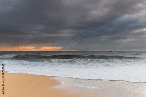 Sunrise Seascape and Rain Clouds